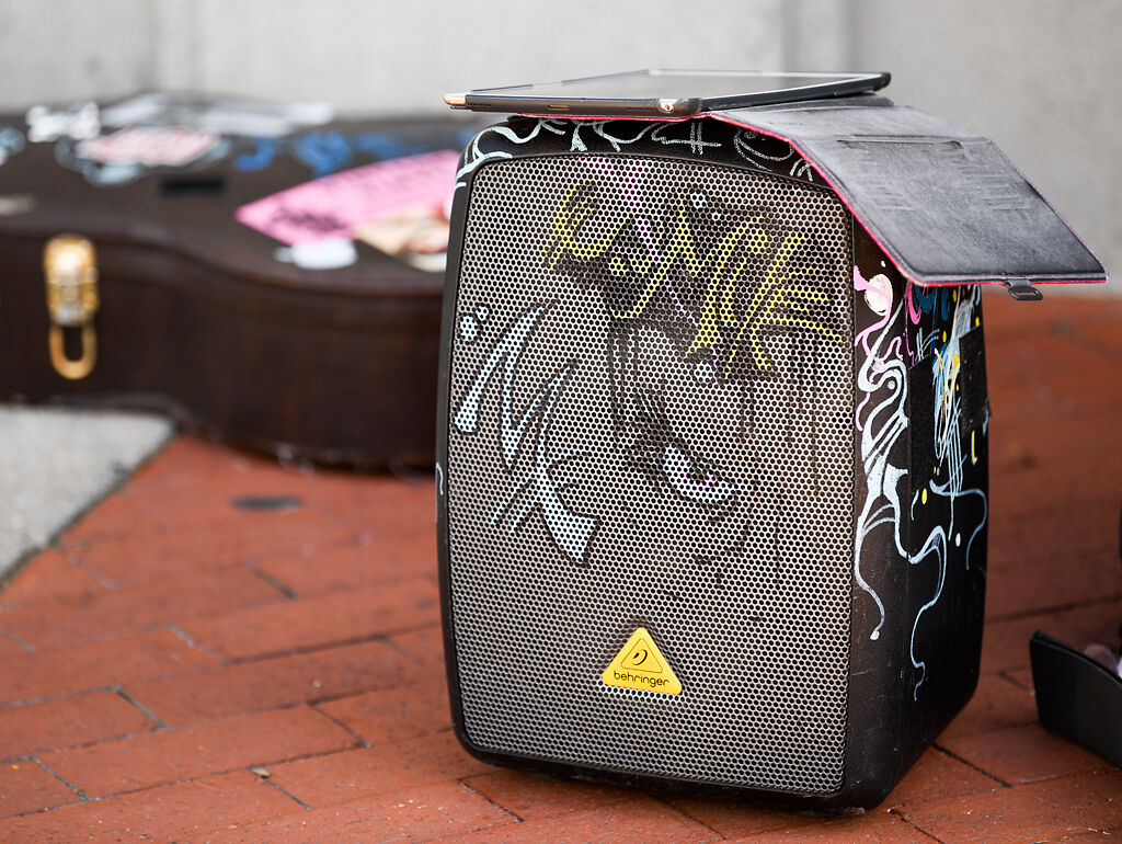 Mike del Rosario’s tablet sits atop his decorated speaker